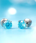 Skip The Itch With These Implant Grade G23 Titanium Screw Back Earrings Featuring Hypoallergenic Design and light blue CZ stones.