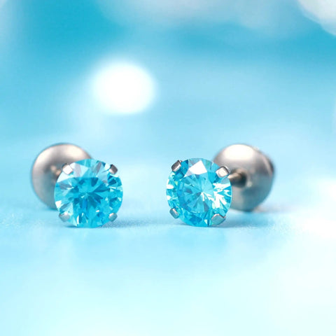 Skip The Itch With These Implant Grade G23 Titanium Screw Back Earrings Featuring Hypoallergenic Design and light blue CZ stones.