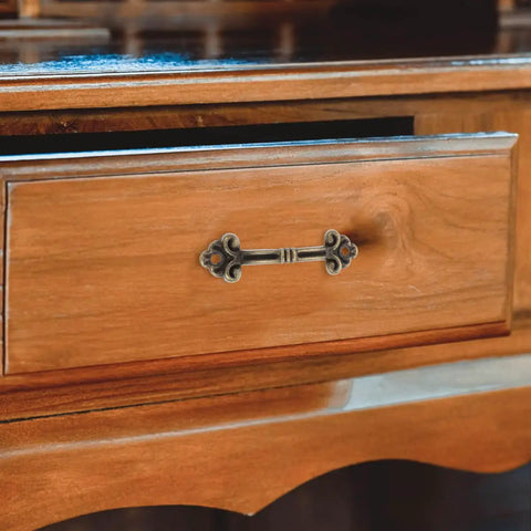 20-Piece Mini Antique Bronze Cabinet Pulls Set For Jewelry Boxes And Small Drawers, Rustic Metal Hardware showcased on a wooden drawer