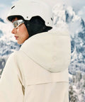 Side view of Women's One Piece Ski Suit Snow Suit Winter Waterproof Outdoor Snowsuit Jumpsuit with hood in snowy mountains.