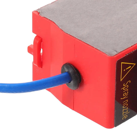Close-up of Heavy Duty Auto Fire Extinguisher Canister Compact Thirty Gram Aerosol Spray Pack with spray nozzle attachment.