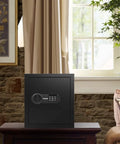 Deluxe Digital Keypad Safe Box For Home Office Hotel And Travel Beefy Steel Alloy Small Safe on a table in living room
