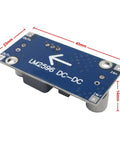 Close-up of LM2596 module from 6 Pack DC To DC Buck Converter Kit With LM2596 Regulator, showing dimensions and input/output labels.