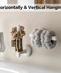 Suction Cup Headband Holder And Wall Mounted Hair Accessory Organizer Keeps Your Bathroom Vanity Looking Fly With This Hassle Free No Drill Scrunchie Storage Rack In Crisp White, featuring scrunchies and a hair clip.