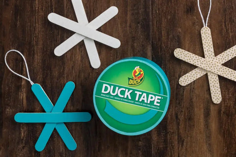 Duck Tape container with crafting paper stars, showcasing Color Duct Tape White Six Roll Pack Heavy Duty Adhesive Tape.