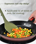 Heavy Duty Silicone Kitchen Utensil Set With Hooks 7 Piece Nonstick Heat Resistant Slotted Spoon Spatula Stirring Fork Spoon Dark Green Durable Kitchen Tools For Cooking And Meal Prep spatula stirring vegetables in a pan.