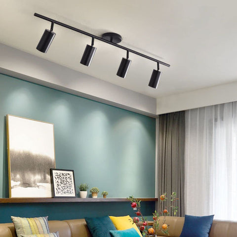 Installed four light black track lighting kit with flexible heads dimmable LED indoor ceiling spotlight mid century modern style