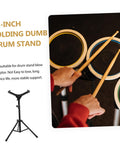 Slick Black Tripod Drum Stand With Heavy Duty Snare Rack And Practice Pad Holder Featuring Adjustable Heights, shown in use with practice pads.