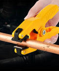 Yellow plastic temperature clamp for HVAC K-Type thermocouple installed on copper pipe