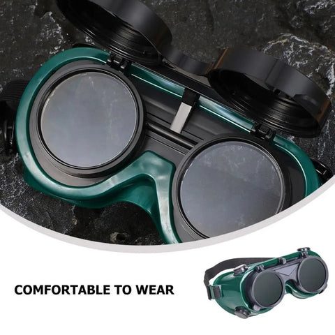 Four Pack Heavy Duty Welding Safety Goggles With Anti Scratch Coating And Double Flip Up Lenses showing dark green dual lenses and sturdy frame.