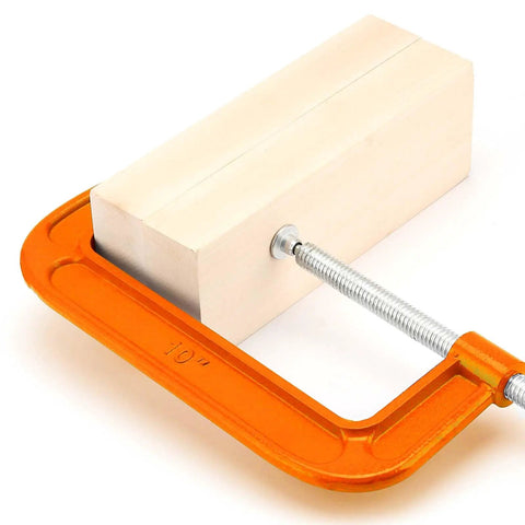 Two Pack 10 Inch C Clamp Set For Woodworking And Metalworking Heavy Duty Cast Iron C Clamp With 8.7 Inch Jaw Opening And 3.7 Inch Throat Depth Durable Orange Finish holding wooden block
