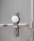 Two Pack Hidden Shackle Puck Padlocks Two And Seven Eighths Inch securing a metal trailer door handle for added security.