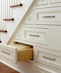 Under-stair drawers featuring Six Pack 5 Inch Center To Center Antique Brass Cabinet Pulls With Knurled Grip And Circular End Caps