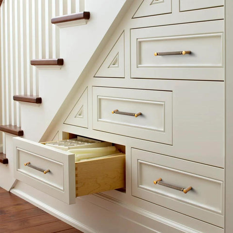 Under-stair drawers featuring Six Pack 5 Inch Center To Center Antique Brass Cabinet Pulls With Knurled Grip And Circular End Caps
