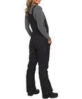Rear view of womens insulated snow bibs for skiing and snowboarding, waterproof windproof overalls with pockets, durable warm winter snowpants, black