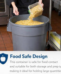 Person pouring food into a 55 Gallon Black Round Commercial Trash Can With Lid And Dolly Built Tough Heavy Duty Food Grade NSF Certified