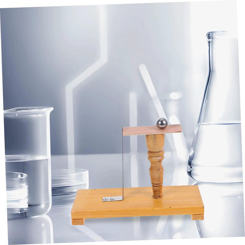 Inertia Demonstrator Pendulum for Science Classroom Teaching and Newtonian Mechanics Experiments Tool on wooden base in lab.