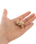 Person holding Dope Cat Shaped Brass Cabinet Door Knob With Smooth Finish, Vintage Gold Cabinet Pull For Kitchen And Home Decor.