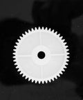 Large gear from 550 Gear Box Set For Kids Must Have Ride On Car Replacement Gears Kit, shown on black background for smooth gearbox operation.