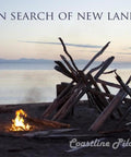 Campfire on beach with driftwood structure under twilight sky, "In Search of New Land" text, Ocean Vibe Track Sail On A Feel Good Indie Pop Song For Road Trips And Summer Nights 2015 Release High Quality MP3 Download With Rich Vocals And A Catchy Chorus For Your Everyday Playlist.