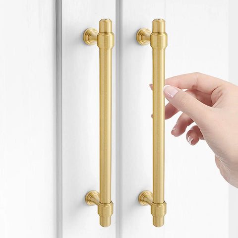 Swanky Gold Finish On Heavy Duty Solid Brass Cabinet Pulls Double Hole Mounting Fits Kitchen Drawers And Wardrobes 260 Millimeter Premium Furniture Hardware shown on a cabinet with a hand touching one pull.
