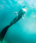 A diver underwater wearing Long Blade Diving Fins For Freediving And Spearfishing, Scuba Swimming Training Gear With Replaceable Polypropylene Blades