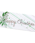 Handmade card with 'Happy Christmas' text using strip frame metal die cut set for scrapbooking and card making, decorative green leaves.