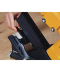 Close-up of Flooring Nailer Rolling Base With Tool Free Thickness Adjustment, showing smooth glide wheels on wood surface.