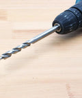 Three Eighths Inch Drill Bit With Depth Stop Collar For Pocket Hole Jig Master System in drill, side view on wood surface
