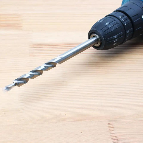 Three Eighths Inch Drill Bit With Depth Stop Collar For Pocket Hole Jig Master System in drill, side view on wood surface
