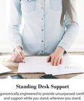 Woman standing at desk using Anti Fatigue Floor Mat With Cushioned PU Comfy For Home Kitchen Garage And Office Standing Desks