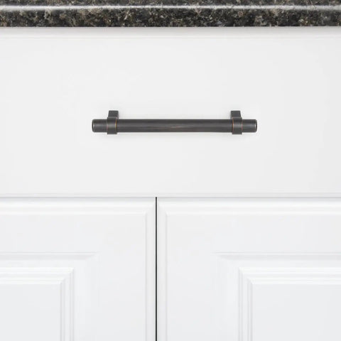 Oil Rubbed Bronze Straight Bar Cabinet Pull 6.63 Inch Length, 5 Inch Hole Center, 1.32 Inch Projection, mounted on white cabinet