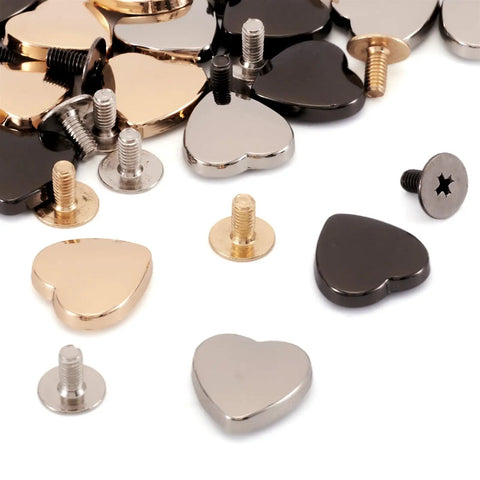 Hassle Free 15 Piece Heart Shaped Leather Rivets Kit Dope Alloy Studs And Screws featuring various heart-shaped studs and screws.