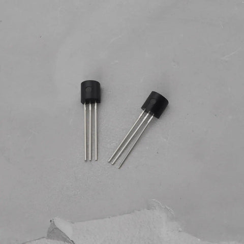 Two TO-92 package transistors from Go-To Transistor Assortment Kit 100 Pcs TO-92 NPN BC550C PNP BC560C for Audio Amplifiers and Signal Processing.
