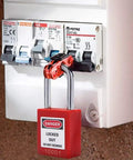 Lockout Tagout Lock Box Kit With Ten Loto Locks showing a red lock on electrical panel for OSHA compliance on work sites.