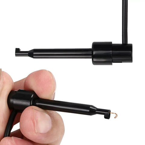 Hand holding Stackable Banana Plug To Test Hook And Alligator Clip Leads Kit For Multimeters, close-up view.