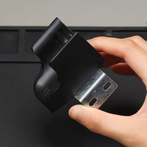 Hand holding Universal Hot Air Gun Holder For Most Rework Stations, Sturdy Aluminum Mount, Non Slip Base, And Quick Release Clamp