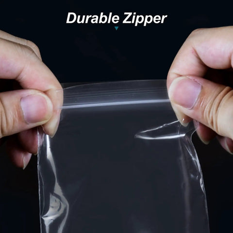 Hands holding open a clear plastic bag with a zipper seal from the Five Size Clear Plastic Bags Mega Pack 500 pcs in 5 assorted sizes.