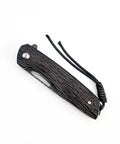 Folded view of Damascus Steel Folding Pocket Knife with 3.35 Inch Blade and Rosewood Handle showing closed position and lanyard.