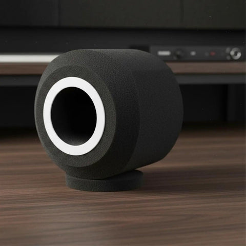 Heavy Duty Microphone Windscreen And Acoustic Foam Guard With Thick Padding for field recordings on a wooden surface.