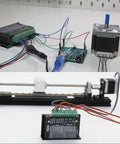 Front view of a TB6600 4A driver module connected to an Arduino-style controller and a NEMA stepper motor with Dupont cables.