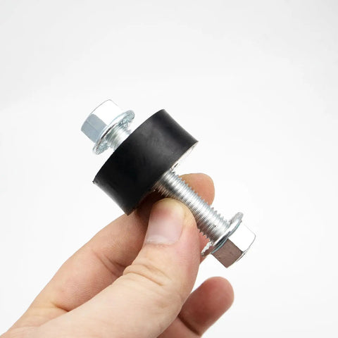 Close-up of a Four Piece Pressure Washer Engine Mounting Hardware Kit Replacement Part held in hand
