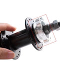 Close-up of 2 Pack 44 Mm Bike Freewheel Threaded Hub with 6 Bolt Disc Rotor Flange Adapter in hand, made from premium aluminum alloy