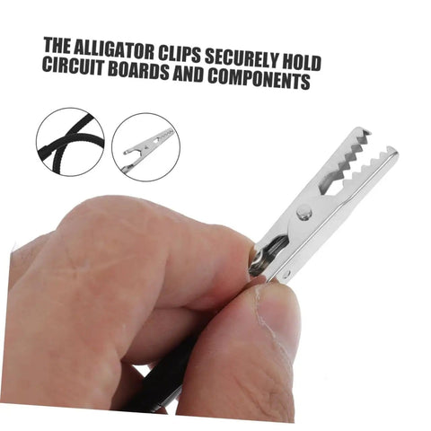 Close-up of hand using alligator clamp soldering helper set with magnifying glass lamp for secure workholding in circuit board repair.