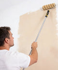 9 Inch Paint Roller Kit With Rustproof Steel Frame And Ultra Thick Nap Pad Designed For Interior Walls And Ceilings in use on a wall.