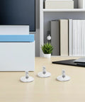 Heavy Duty Adjustable Furniture Leveling Feet, Rock Solid Swivel Base on a desk with a modern workspace background.