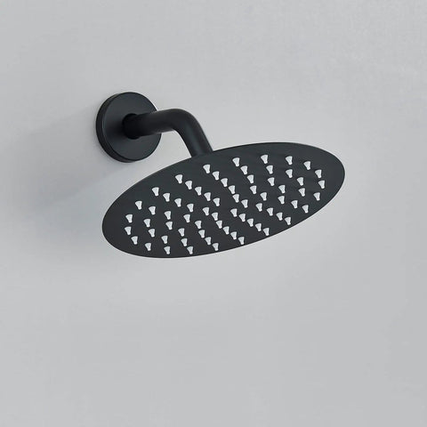 Matte Black Shower System With 8 Inch Round Shower Head And Handheld Spray Brass Rough In Valve Durable Stainless Steel Hose And Complete Trim Kit For No Fuss Installation round shower head close-up.