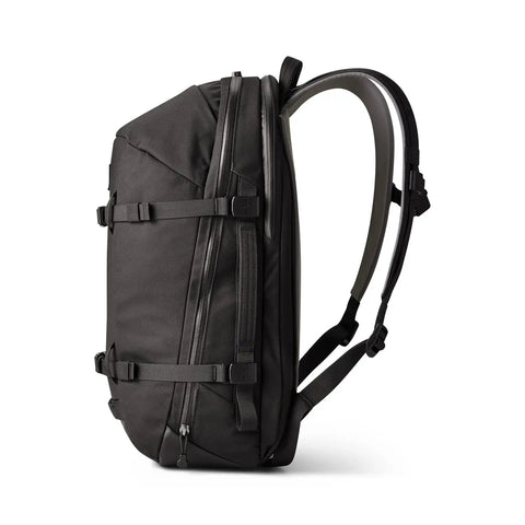 Side view of Crossroads 27L Everyday Backpack, black, with padded straps and TuffSkin Nylon, for commuters and weekend warriors.