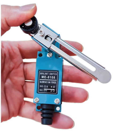Close-up of Heavy Duty Silver Contact Limit Switch ME8108 with adjustable roller lever, held in hand showing blue casing and metal arm.