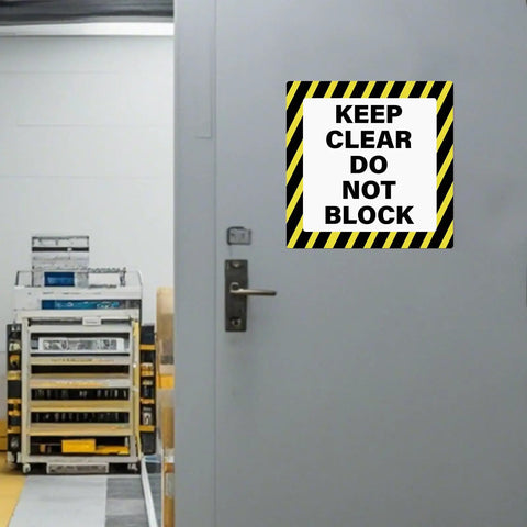 Keep Clear Do Not Block Sign 17 By 17 Inches 5 Pack Self Adhesive Waterproof Vinyl Safety Stickers installed on warehouse door